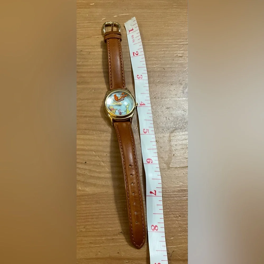 Disney: Pooh, Piglet, Rabbit, parachuting Tiger Disney Catalog gold brown watch.